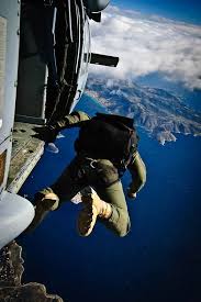 A Sailor Assigned To Naval Special Warfare U S Special Boat Team Jumps Out Of The Mh 60s Sea Hawk Helicopter Ghostrider 5 Skydiving Extreme Sports Military