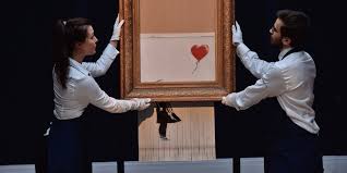 A painting by mysterious british artist banksy shred itself into pieces at the moment it sold for more than €1.2m at a london auction yesterday. Banksy Sotheby S Shredder Stunt Was All Smoke And Mirrors Artlyst