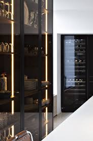 Stunning modern italian black glass and brass side cabinet. Liedssen Kitchen Interior Dark Glass Cupboard Doors Glass Kitchen Cabinets Luxury Kitchens Glass Kitchen