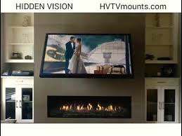 Hidden vision tv mount with traditional home theater and bookends storage tv cabinet tv frame wall mounted tv wood cabinets traditional home theater photo credit to amidesigns.com. Hidden Vision 65 Flip Around Tv Mount Youtube
