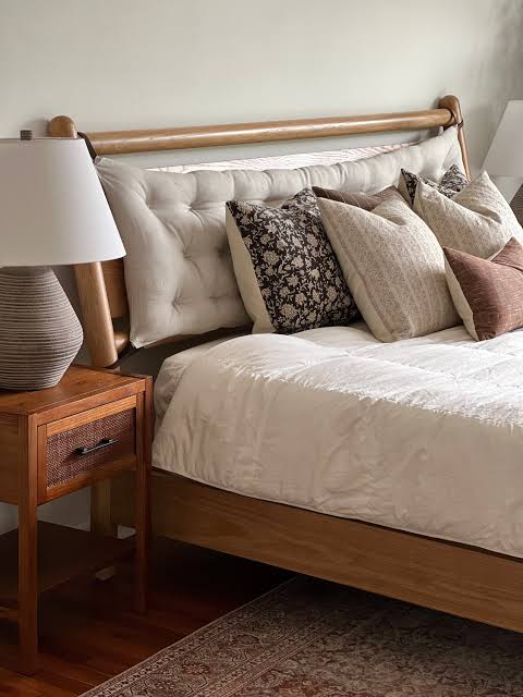 Tufted upholstered bed with padded headboard