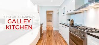 The kitchen itself is simple and modern, with white kitchen cabinets, back splash and counter top, creating a crisp, clean look. Galley Kitchen Layout Ideas Design Tips Inspiration