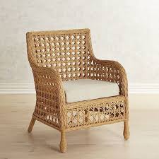 Think Of The Classic Rattan Chair And We Bet This Springs To Mind Hand Woven Of Honey Hued Rattan I Rattan Armchair Wicker Furniture Upholstered Swivel Chairs