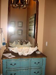 Classic white subway tile mixes with vintage finds, such as the old farm stool and a refurbished wall sink. Pin On Cool Things