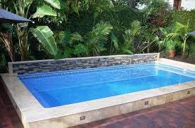 This Islander Pool Is 14 X 28 With A Raised Back Ledger Stone Wall And Lower Travertine Tile Finish The Islan Rectangular Pool Islander Pools Swimming Pools