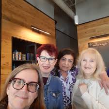 Lyla enjoying her coffee and donut this morning