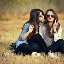 Fareesa Bff Photoshoot Friend Photoshoot Girl Photo Poses Black and white photo of a cute smiling ballerina in white tutu and a crown laying on the floor with hands under the chin. girl photo poses