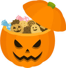 かぼちゃのランタンにお菓子が詰まっているフリーイラスト素材