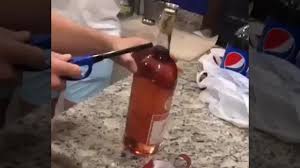 Take your lighter and start the heating process just below the cork on the neck of the bottle. How To Open A Bottle Of Wine With A Lighter Videoman