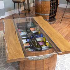 Wine barrel storage bottle coffee table offers a one of a kind look. Wine Barrel Bottle Storage Coffee Table Wine Country Accents