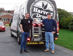 Harvest Drop owner Oliver Gubenko with Carl Boettcher of HTS Systems.  Sprinter 3500 refrigerated food service cargo delivery van with HTS-20S-HM  Swing Mount Ultra-Rack unit.