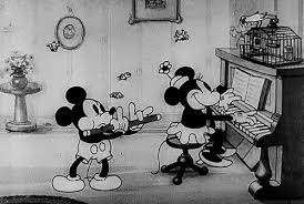 Mickey mouse is a cartoon character created in 1928 by walt disney and ub iwerks at the walt disney studios, who serves as the mascot of the walt disney company. 12 Little Known Mickey And Minnie Mouse Facts E Online