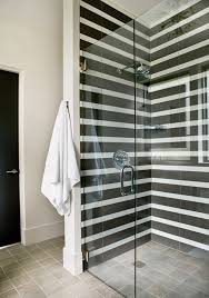 Black And White Subway Tile Applied In Stripes For A Modern Graphic Finish Bathroom Design Striped Tile Bathroom Inspiration