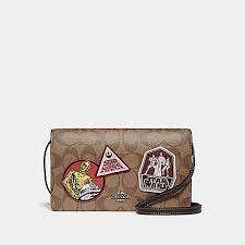 Here is a look at some of the amazing new items! Coach F88921 Star Wars X Coach Hayden Foldover Crossbody Clutch In Signature Canvas With Patches Qb Khaki Multi Coach Handbags