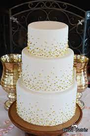 This Simple Wedding Cake Becomes The Star Of The Show With The Addition Of Subtle Gold Beads O Simple Wedding Cake Beaded Wedding Cake Wedding Cake Decorations