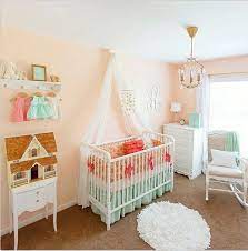 A coral and teal nursery with a light and bright color scheme consisting of shades of coral and peach, with touches of gold and teal. Vintage Peach And Mint Nursery Columbus By Lottie Da Baby Houzz