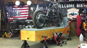Homemade motorcycle lift constructed from 3/4 plywood, gi pipe, and wooden planks. Motorcycle Table Youtube
