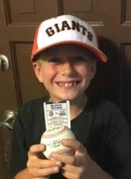 A stranger's kindness turns a child's day around at a baseball game