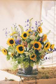 Don't be afraid to carry an entire bouquet of these gorgeous blooms… they go with everything. Flowers And Gardens Sunflower Centerpieces Sunflower Arrangements Flower Arrangements