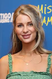 Olivia Newman-Young Outfits & Style Photos • CelebMafia