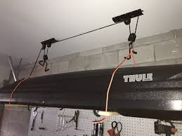 We got sick and tired of our fishing rods getting tangled, so we came up with this easy fishing rod organizer. How To Make A Diy Garage Ceiling Pulley Lift System For A Thule Ski Cargo Box