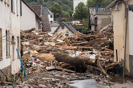 .in germany after heavy flooding turned streams and streets into raging torrents, sweeping away cars a firefighter wades through a street in kordel, germany, which was flooded by the kyll river. Z4hftfwioj5vcm