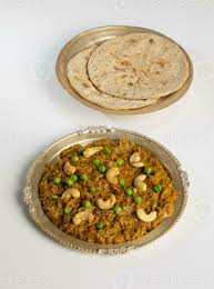 Rajasthani Famous Traditional Cuisine Haldi Sabji or Tukkar Served with  Salad on White Background 35242792 Stock Photo at Vecteezy