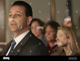 ATF agent Mark Potter, left, speaks during a news conference at Coatesville  City Hall in Coatesville, Pennsylvania, about the apprehension of Roger  Leon Barlow Jr., a suspect in the arson fires that