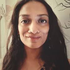 A woman who is busy at work pursuing client payments, accounts and…