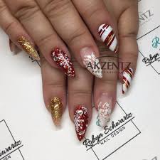Snowflakes And Christmas Glitters On Almond Gel Nails Christmas Gel Nails Christmas Nails Acrylic Christmas Nails Easy
