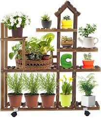 For a tall stand, remove the back half of a tall wood stepladder, and lean the ladder against the wall so the top platform is horizontal. Tall Plant Stand With Wheels 5 Tier Wood Home Shape Flower Shelves Indoor Outdoor Planter Rack For Patio Garden Corner Balcony Living Room Walmart Com Walmart Com