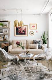 The round coffee table in this photograph is edged with rose gold with the same gold on the legs and supports. Cool Small Round Coffee Table Ideas 20 Functional Designs