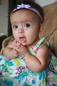 My Baby Girl Is Soooo Cute With An Extra Chromosome She Has Down Syndrome Down Syndrome Kids Down Syndrome Baby Cute Babies