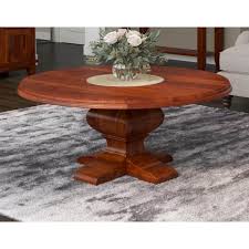 I've been wanting a round coffee table and love the look of a pedestal table. Sierra Nevada Rustic Solid Wood Pedestal Round Coffee Table