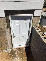 The ultra series basement door features polyethylene construction that will never rust, rot or need painting. After Outside Entrance Basement Door Egress Windows Long Island N Y Exterior Access Doors Adds Value Basement Doors Basement Entrance Egress Window