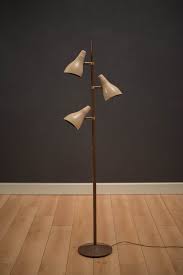 Gerald thurston earned an industrial Mid Century Three Shade Floor Lamp By Gerald Thurston Mid Century Maddist