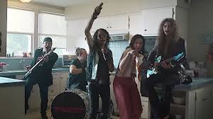 He's flanked by two fitness assistants, a male to his right and a female to his left. Hair Metal Veterans Ratt Star In New Geico Commercial Watch