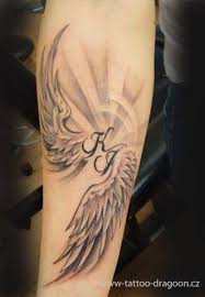 Rather than a whole angel, some people opt for an angel wings tattoo. 19 Name Tattoos With Angel Wings