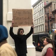 Dude With Sign Holds Up Random Protest Signs With Declarations That May Not Seem Relevant At The Time Funny Signs Funny Pictures Protest Signs
