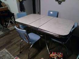 Constructed from metal overlaid with a walnut wood grain effect finish, the tabletop and seats feature a contrasting white wood grain effect finish that lends a cool, contemporary look. 1950 S Dinette Set Ebay