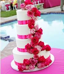 White Wedding Cake With Hot Pink And Red Roses Pink Wedding Cake Pink And White Weddings Pink Wedding