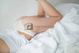 attractive girl with cute ass in bed by fotoduki Vectors & Illustrations  with Unlimited Downloads - Yayimages