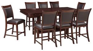 Table made of pine wood, veneers and engineered wood. Collenburg Counter Height Dining Table And 8 Barstools D564 32 124 8 Kitchen Dining Room Table Sets National Mattress Furniture Warehouse