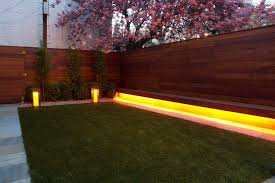 Garden Fence Lighting Ideas Landscape Modern With Modern Garden Synthetic Grass Cedar Bench Fence Lighting Modern Fence Fence Landscaping