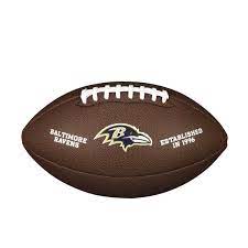 The baltimore ravens logo has purple, black, metallic gold, and red colors and the side profile of a raven facing right with a letter b object on its head. Nfl Team Logo Komposit Football Offiziell Baltimore Ravens Wilson Sporting Goods