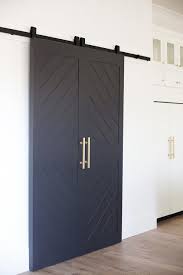 Black And White Barn Door Black Sliding Barn Door With Large Oversized Gold Hardware Interior Barn Doors Barn Doors Sliding Modern Barn Door