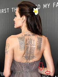 Have picked out a few and looked at the angelina jolie attended the dumbo premiere in los angeles in early march wearing a stunning white chiffon. Angelina Jolie S 21 Tattoos Their Meanings Body Art Guru