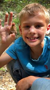 Exploring the hillside by the creek with my grandson in Louisiana