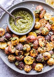 These Four Ingredient Parmesan Pesto Roasted Potatoes Will Become A Staple Side Dish In Your Home They Only Recipes Potato Side Dishes Roasted Potato Recipes