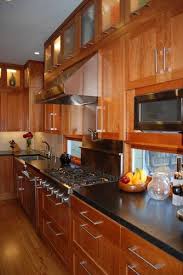 Combining wood base cabinets with white upper cabinets instills this kitchen with an aesthetic that is light, bright, and uncluttered. Pin On Home Sweet Home